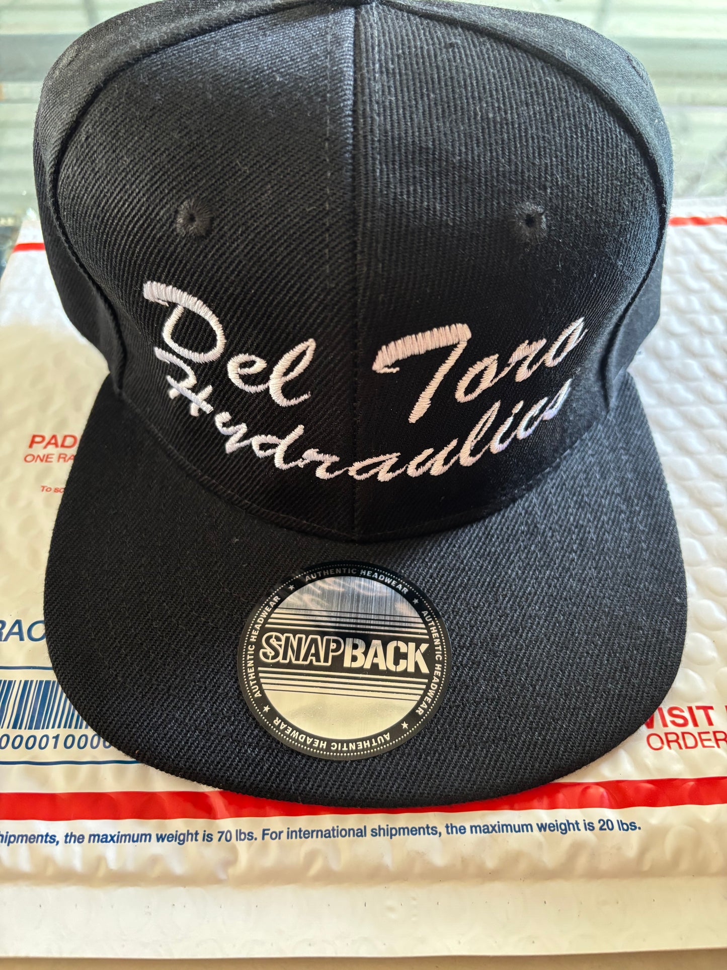 Del Toro Hydraulics snap back white letters